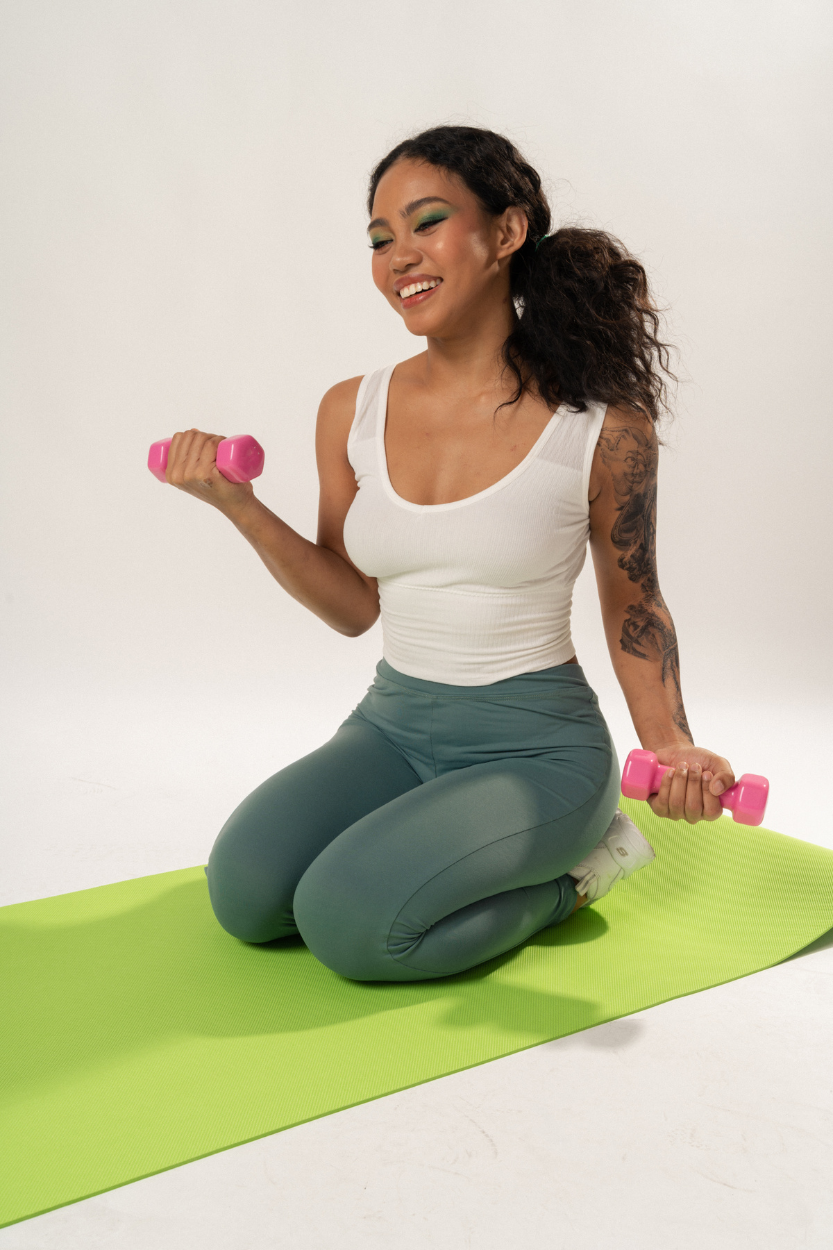 Woman in Activewear Exercising on White Background
